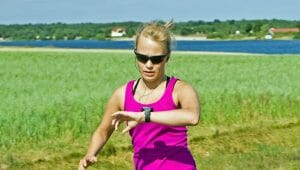 Woman running on country road